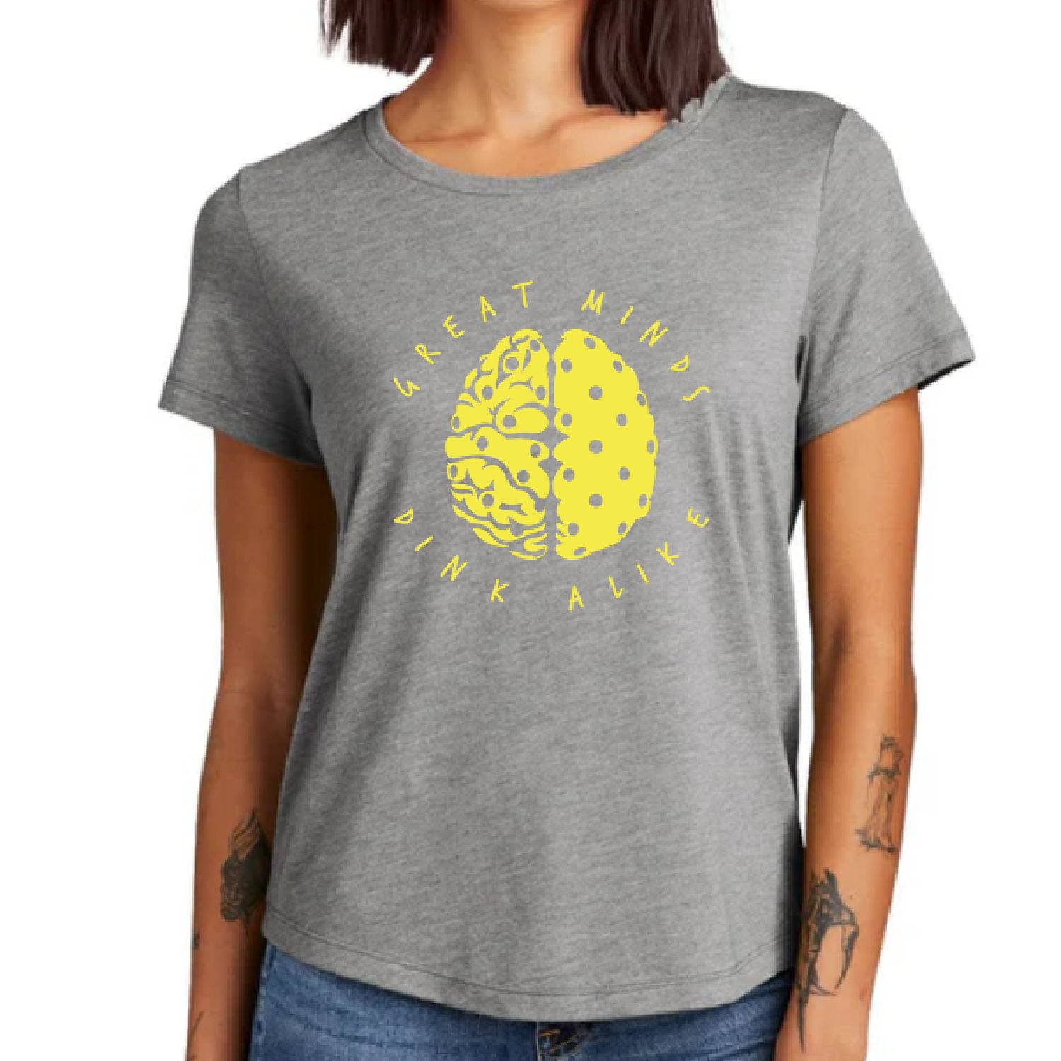 Women's Pickleball Shirt light gray with yellow Great Minds Dink Alike and brain image with pickleball holes in it